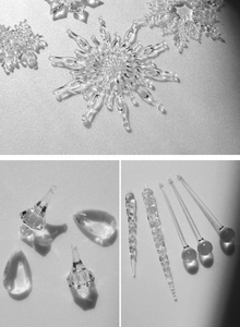 Detailed macro view of crystal snowflake, drop, and icicle Christmas tree ornaments