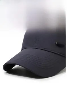 Close-up of navy blue quick-dry baseball cap with SPORTS metal logo and neat stitching