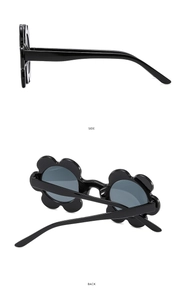 Detail view showing side and back angles of black flower shaped fashion sunglasses