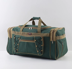 Detail of large capacity travel bag with green oxford fabric and tan webbing straps
