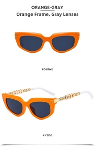 Detail of orange cat eye sunglasses with golden chain metal temples and grey lenses