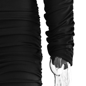 Close-up detail of black ruched stretch fabric with elegant pleated texture on a dress