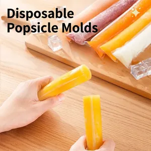 Food-grade disposable ice pop bags filled with colorful fruit juice on wooden board