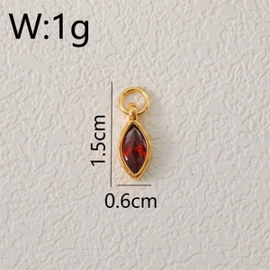 Detailed macro view of 1.5cm red marquise zircon pendant with gold plated setting and ring
