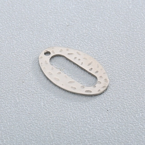 Irregular hammered silver oval stainless steel pendant with textured surface detail