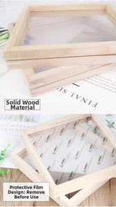 Detail of natural wood picture frame texture with acrylic protective film being peeled off