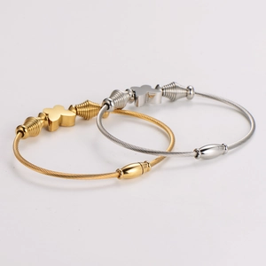 Gold and silver wire butterfly bracelets with magnetic clasp in high-detail view