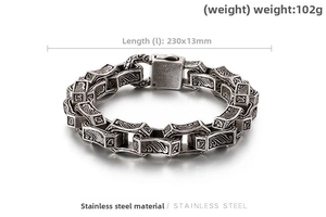 Detailed view of vintage stainless steel bracelet with engraved patterns and clasp