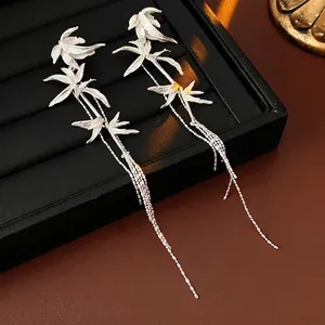 Silver bamboo leaf fringe tassel earrings in long drop style for a minimalist look