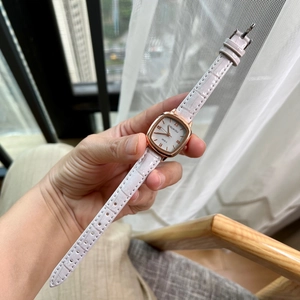 Women's square rose gold watch with white roman dial and textured leather strap