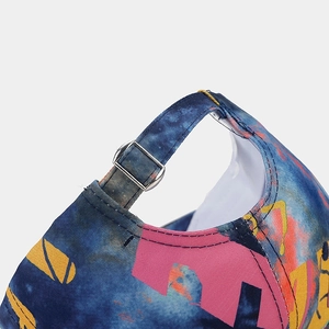 Detail of adjustable silver metal buckle and vibrant digital print on the baseball cap