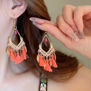 Bohemian gold tassel earrings with pink beads and leaf charms for ethnic retro style