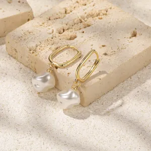 Macro detail of S925 hallmark on gold-plated rectangular clasp with baroque pearl