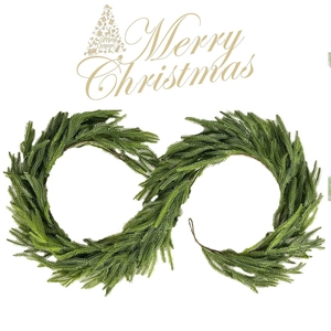 Detail of infinity-shaped artificial Norfolk pine needle wreath with Merry Christmas text