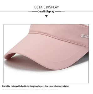 Detail of pink visor with sturdy brim stitching and SPO logo on quick-dry fabric