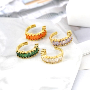 Detail view of gold-plated S925 silver ear clips with colorful rectangular zircons