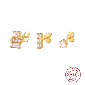Detailed macro view of S925 sterling silver stamp on gold earrings with pearls and zircon