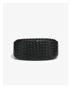Close-up of the black woven leather texture and craftsmanship on this shoulder bag