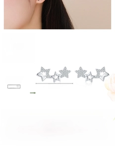 Macro shot of S925 sterling silver star stud earrings with cubic zirconia detail