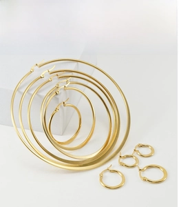 Flat gold titanium steel hoop earrings in seven various sizes for women