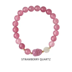 Detail of strawberry quartz beaded bracelet with gold spacers and zircon accents