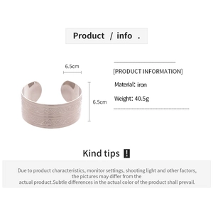 Detailed view of bohemian iron open cuff bracelet with engraved floral patterns and dimensions