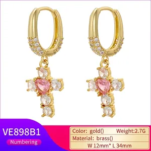 Luxurious gold oval hoop earrings featuring pink heart zircon and cross pendants