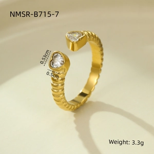 Detail view of gold open ring with dual heart zircons showing 3.3g weight and size data