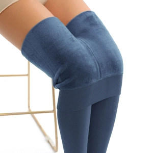Detailed close-up of dark blue thermal leggings with thick pearl fleece lining for winter