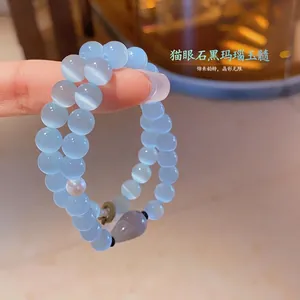 Light blue cat eye stone beaded bracelet with gray chalcedony drop and pearl accent