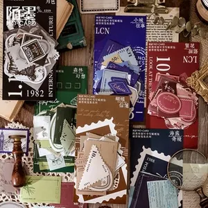 Macro shot of vintage scrapbooking stickers with stamp and label designs on wooden desk