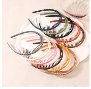 Close-up of matte thin wave headbands with anti-slip teeth in various Morandi colors