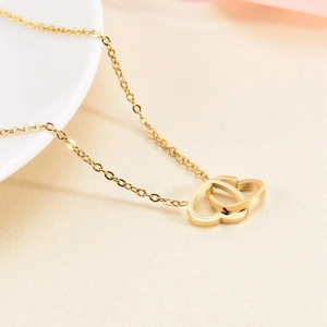 Minimalist gold double heart pendant necklace in polished titanium steel for women
