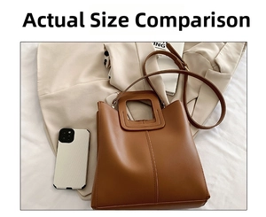 Brown PU leather bucket bag with hollow square handle on a beige blazer setting