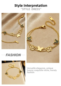 Detail of gold double chain bracelet featuring hollow and black enamel butterfly charms