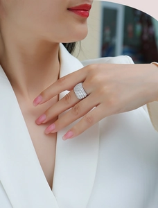Close-up of wide S925 silver ring with multi-row pavé moissanite on model hand