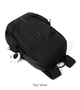 Top view of minimalist black waterproof backpack with hidden vertical zipper detail