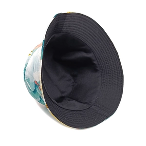 Close-up of double-sided bucket hat featuring watercolor floral print and black lining