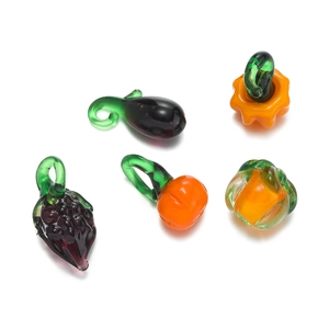 Assorted colorful glass fruit and vegetable charms including grapes and pumpkin for DIY