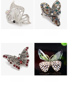 Macro detail of alloy butterfly brooches with rhinestones and colorful gemstone inlay