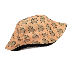 Detailed macro shot of light orange capybara pattern on a summer sun protection bucket hat