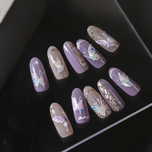 Dreamy purple butterfly press-on nails with holographic accents and silver glitter finish