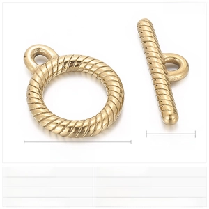 Macro view of gold-plated stainless steel OT toggle clasp with spiral texture and measurements