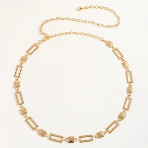 Detail of gold geometric chain belt featuring rectangular frames and a lobster clasp closure