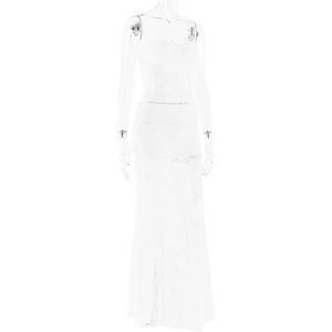 Close-up of white lace maxi dress with delicate floral embroidery and sheer straps
