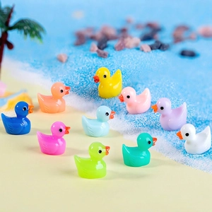 Set of 10 colorful mini resin duck figurines arranged on a summer beach themed scene
