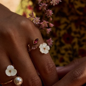 Detailed view of adjustable 18K gold stainless steel ring with pearl and shell floral petals
