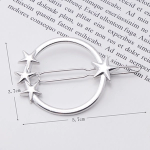 Close-up of silver metal bow hair clip with star accents and precise size measurements