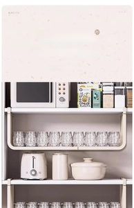 Detail of white metal under-shelf storage basket holding glass cups in kitchen cabinet