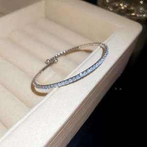Close-up of a silver tennis bracelet with brilliant cubic zirconia in a jewelry box